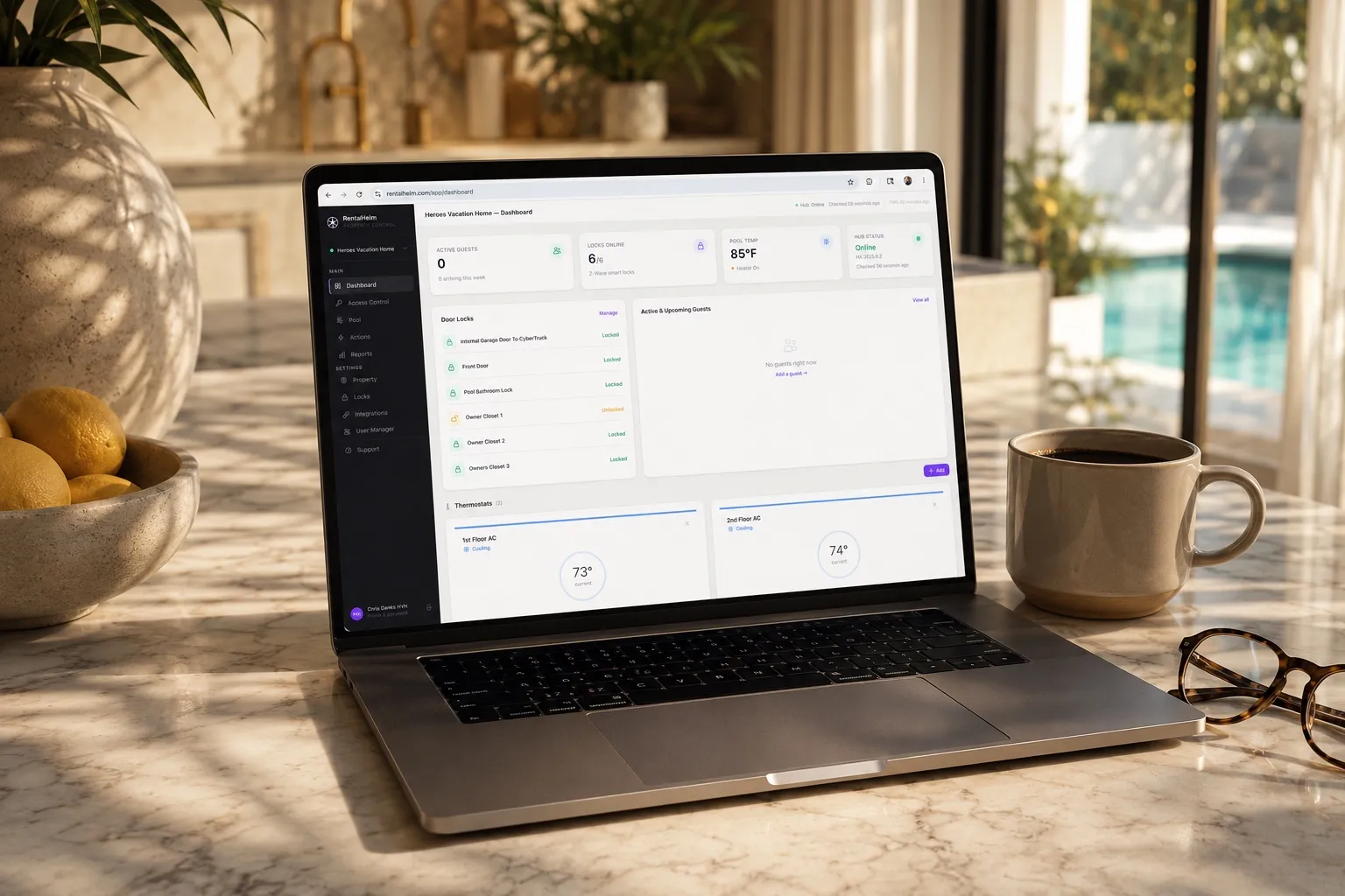 RentalHelm dashboard open on a MacBook on a marble kitchen counter in a Florida vacation home